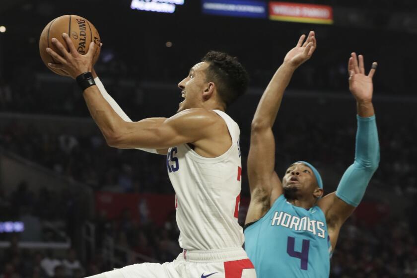 LOS ANGELES, CA, MONDAY, OCTOBER 28, 2019 - LA Clippers guard Landry Shamet (20) drives past Charlotte Hornets guard Devonte' Graham (4) during first half acton at Staples Center.(Robert Gauthier/Los Angeles Times)