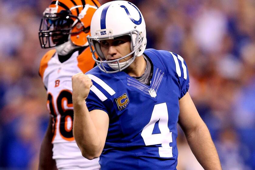 Colts kicker Adam Vinatieri reacts after making a field goal against the Bengals in the second half of their AFC wild-card playoff game Sunday in Indianapolis.