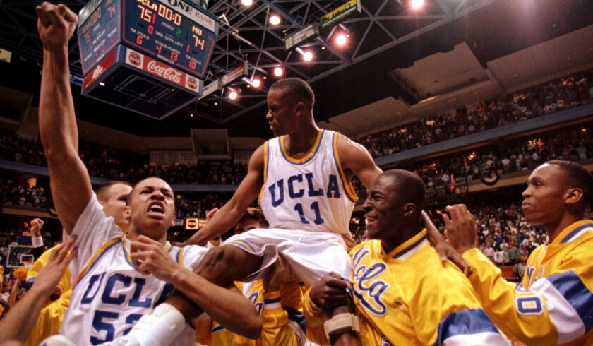 UCLA teammates carry Tyus Edney off the court after he made the game-winning shot to beat Missouri, 75-74, in the NCAA West Regional on March 19, 1995.