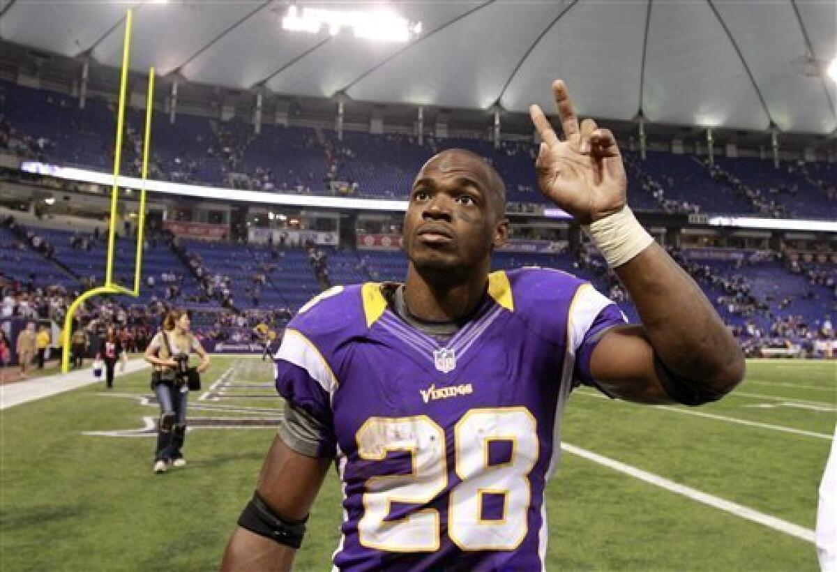 Minnesota Vikings running back Adrian Peterson walks off the field after an NFL football game against the Tennessee Titans, Sunday, Oct. 7, 2012, in Minneapolis. The Vikings won 30-7. (AP Photo/Genevieve Ross)