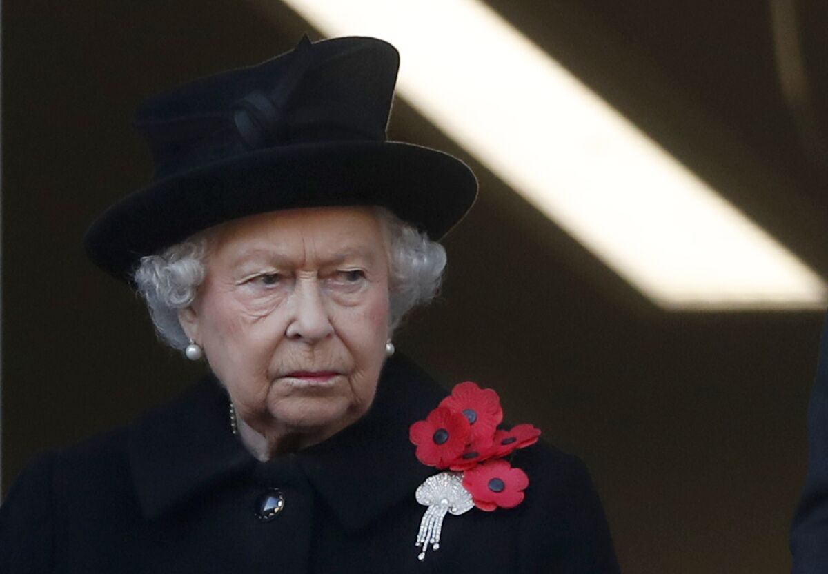 FILE - Britain's Queen Elizabeth II attends the Remembrance Sunday ceremony at the Cenotaph in London, on Nov. 11, 2018. Buckingham Palace says Queen Elizabeth II has sprained her back and will not attend the Remembrance Sunday service in central London to remember Britain’s war dead, Buckingham Palace said Sunday, Nov. 14, 2021. (AP Photo/Alastair Grant, File)