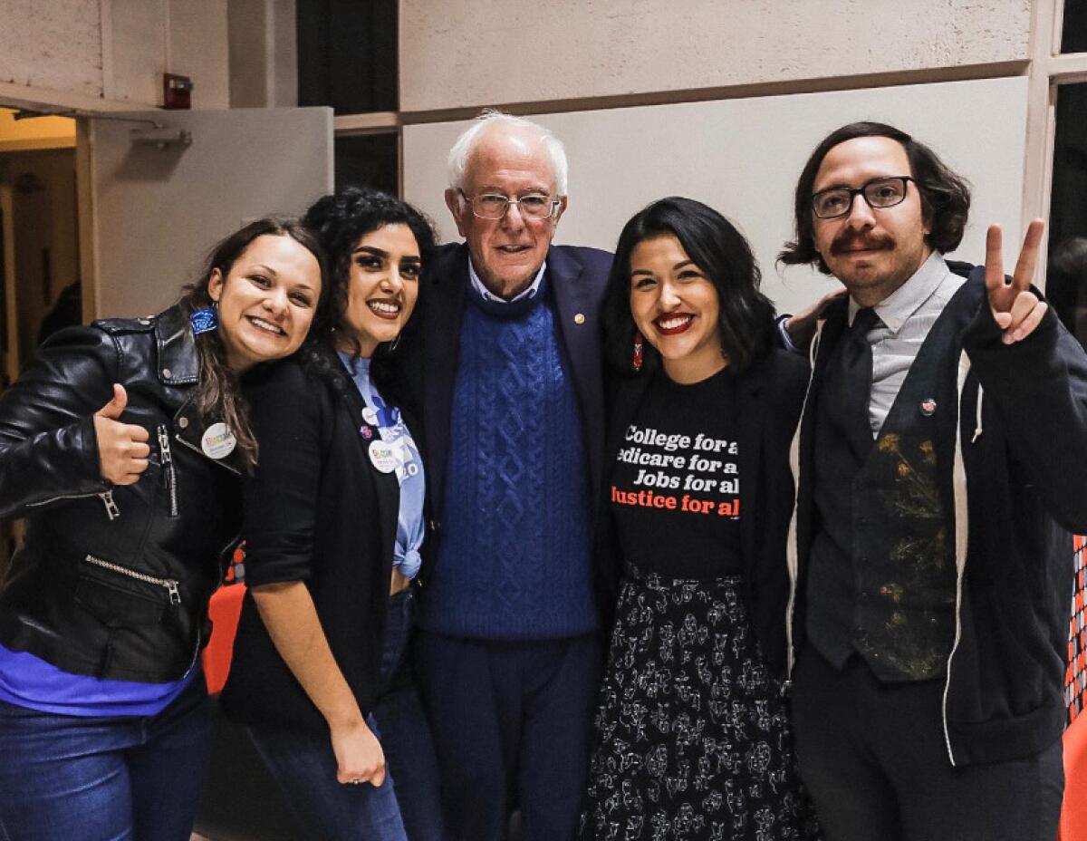 Jewel Hurtado, 21, second from right, with Sen. Bernie Sanders.