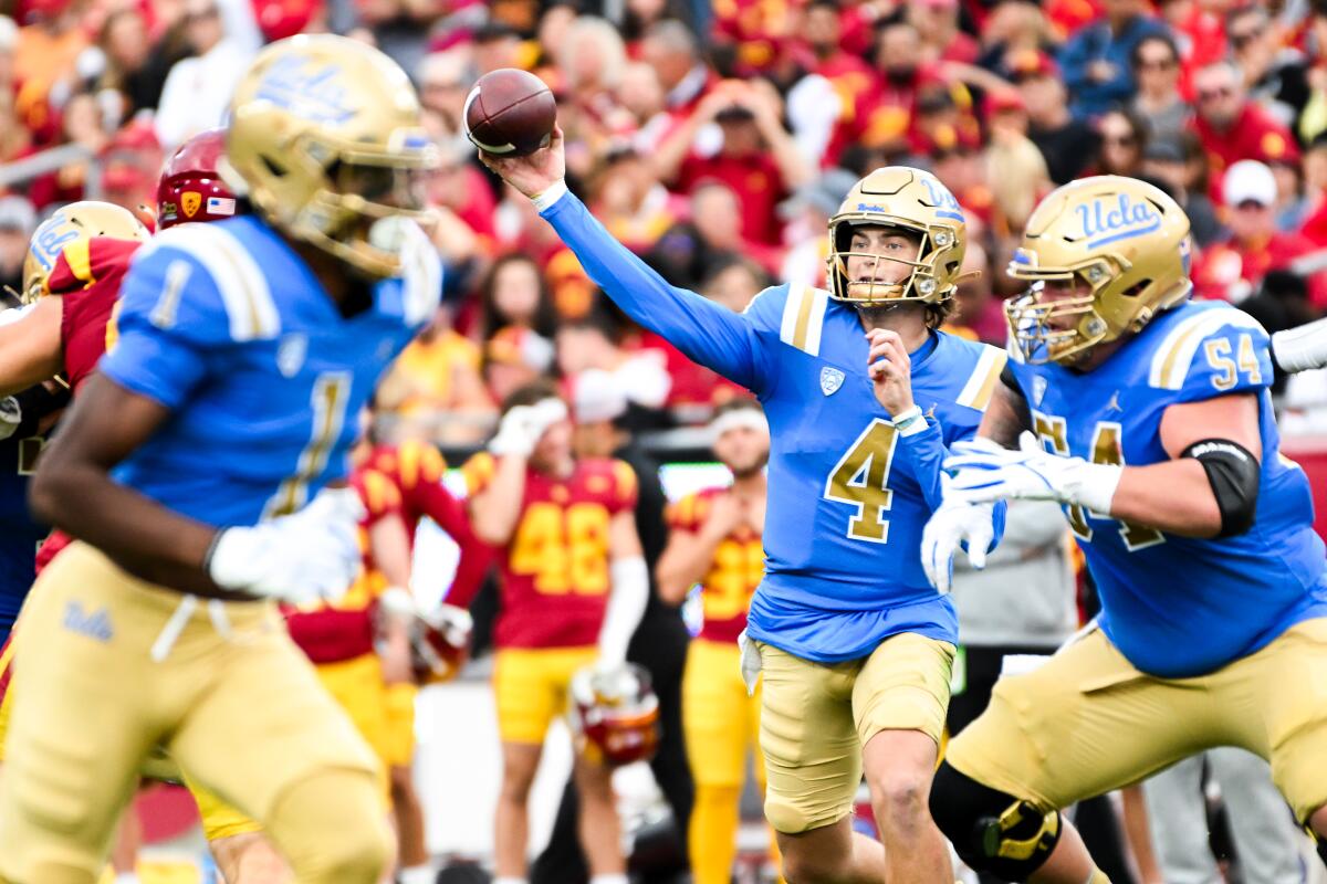 UCLA's Ethan Garbers throws a pass during a football game against USC