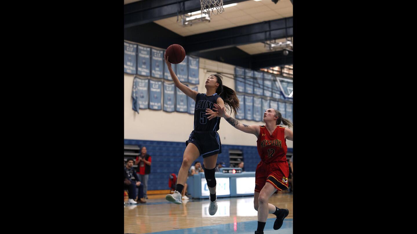 Corona del Mar High's Samantha Uehara lays the ball in against Mission Viejo during the first half in the CdM Tip-off Tournament on Tuesday, November 27, 2018.