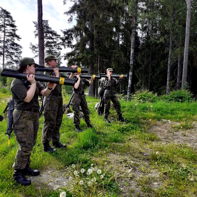 Women hold weapons.