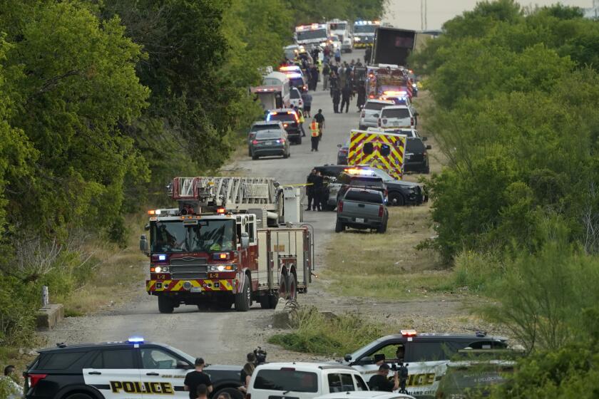 Police block the scene where a semitrailer with multiple dead bodies were discovered, Monday, June 27, 2022, in San Antonio. (AP Photo/Eric Gay)