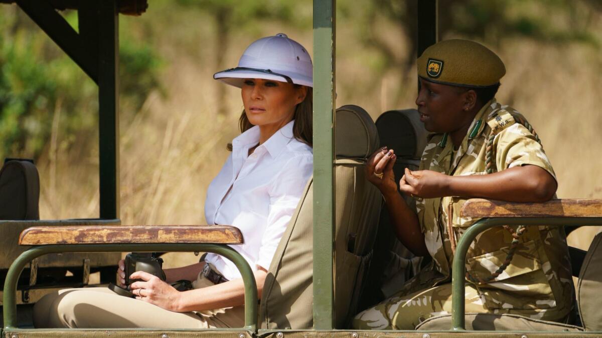 First Lady Melania Trump looks out over Nairobi National Park in Nairobi, Kenya, during a safari guided by park manager Nelly Palmeris.