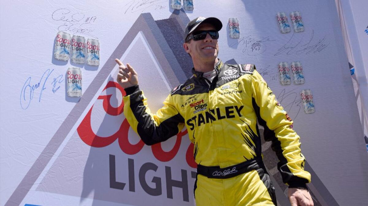 NASCAR driver Carl Edwards celebrates after winning the pole during qualifying for the Save Mart 350 at Sonoma Raceway on June 25.