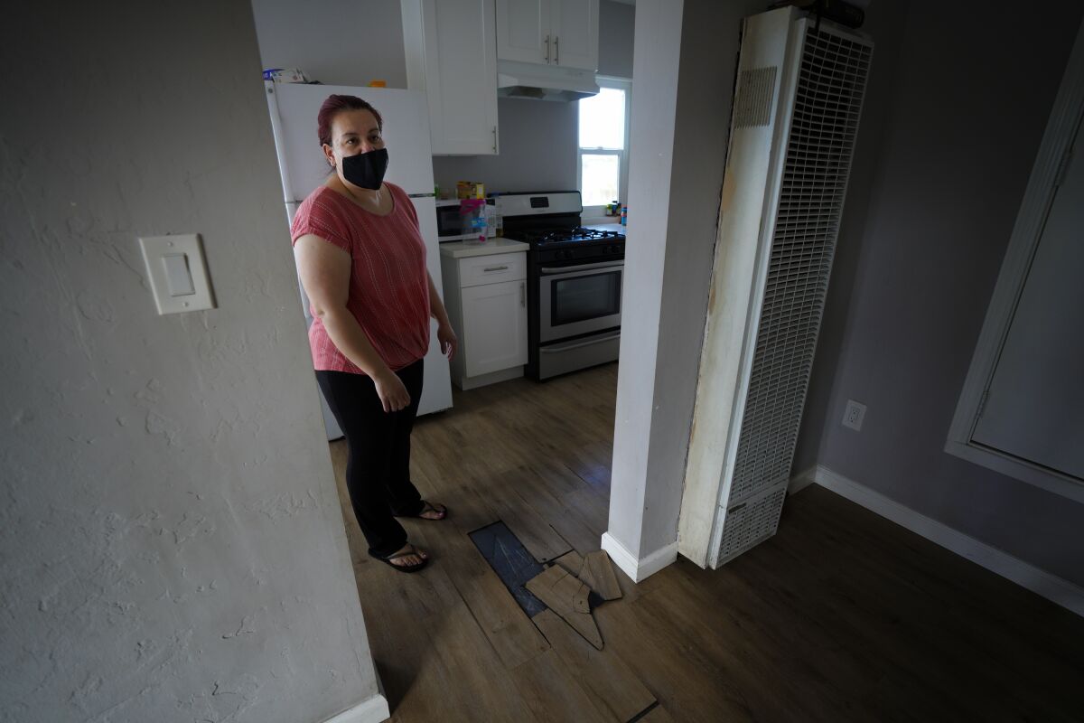 Gema Salazar pointed out the floor tiles are always peeling off in various locations through out her apartment.
