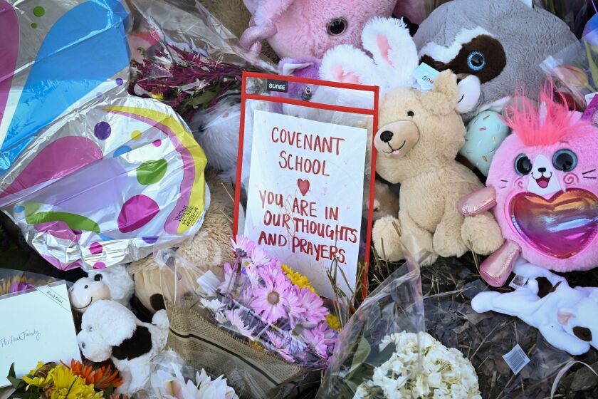 A message to the school is one of many at a memorial for victims at an entry to Covenant School, Tuesday, March 28, 2023, in Nashville, Tenn., following a fatal shooting a day earlier. (AP Photo/John Amis)