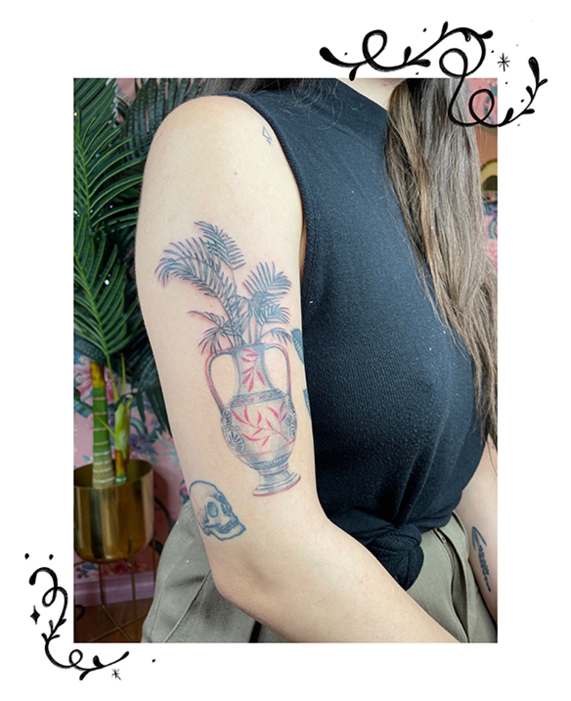 Amphora with palm plant tattoo on an arm.