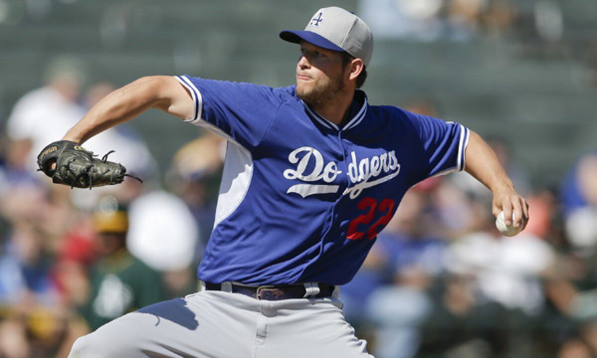 Dodgers starter Clayton Kershaw delivers a pitch during Monday's Cactus League game against the Oakland Athletics.