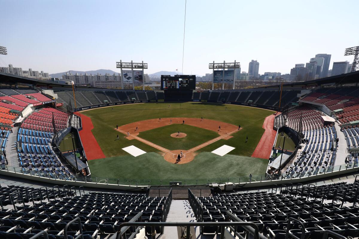 The LG Twins play an intrasquad scrimmage with no spectators present April 5 in Seoul. 
