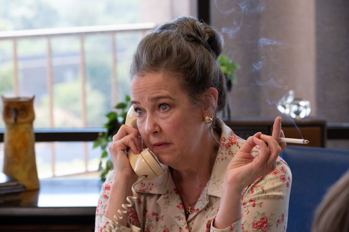 Harriet Sansom Harris takes a phone call in a scene from "Licorice Pizza"