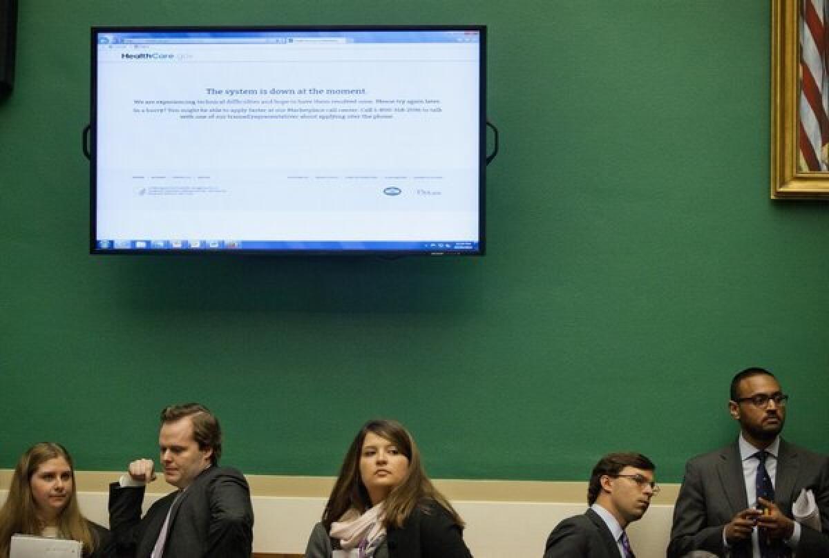 An error message from the healthcare.gov website is displayed during a congressional hearing Wednesday on the federal insurance enrollment exchange.