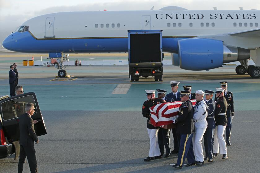 An armed forces color guard carries the body of U.S. Sen. Dianne Feinstein, D-Calif., toward a hearse at San Francisco International Airport, Saturday, Sept. 30, 2023, in San Francisco. (Santiago Mejia/San Francisco Chronicle via AP)