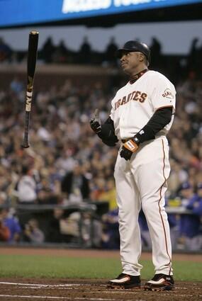 Barry Bonds tosses his bat after taking a called third strike from Dodgers Chad Billingsley.