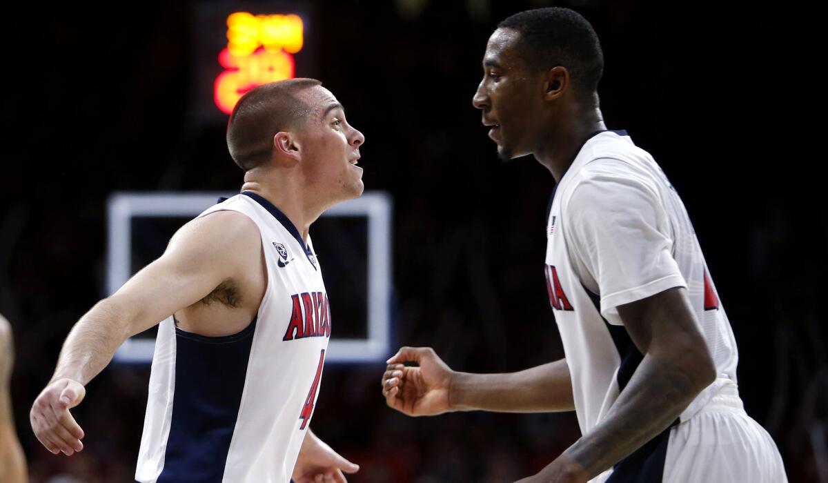 Arizona guard T.J. McConnell, left, and forward Rondae Hollis-Jefferson celebrate during the second half of their rout of Oregon State on Jan. 30.