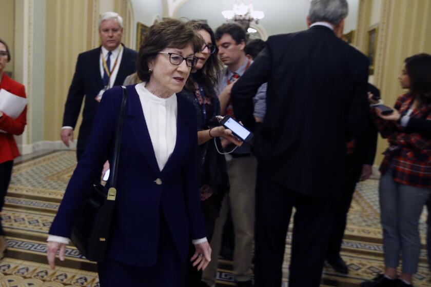 Sen. Susan Collins, R-Maine, walks past the Senate chamber prior to the start of the impeachment trial of President Donald Trump at the U.S. Capitol Friday Jan 31, 2020, in Washington. Senators continue the impeachment trial for President Donald Trump. (AP Photo/Steve Helber)