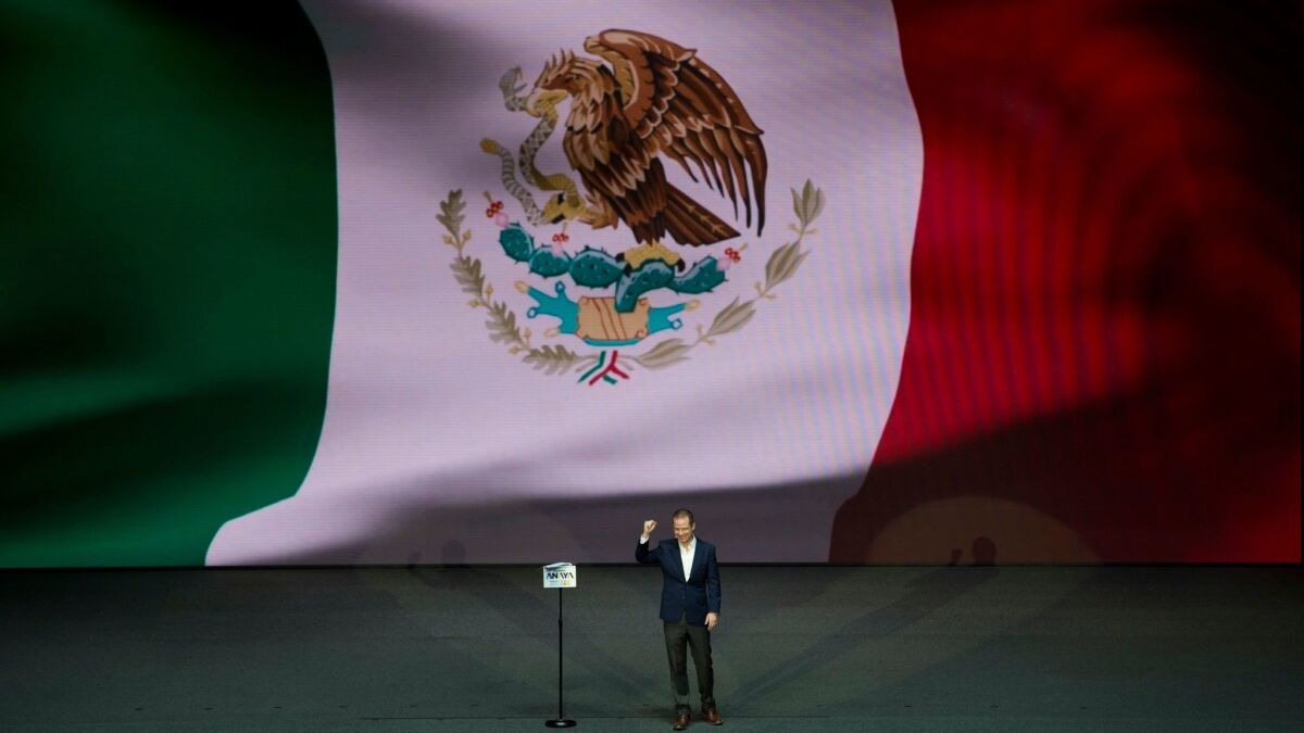Ricardo Anaya of the conservative National Action Party makes his pitch to supporters at the National Auditorium in Mexico City on Feb. 18, 2018. Anaya was sworn in as the candidate of a coalition with the left-leaning Democratic Revolution Party.