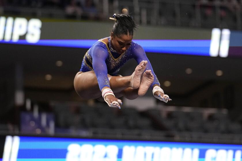 UCLA's Jordan Chiles competes on the uneven parallel bars during the semifinals.