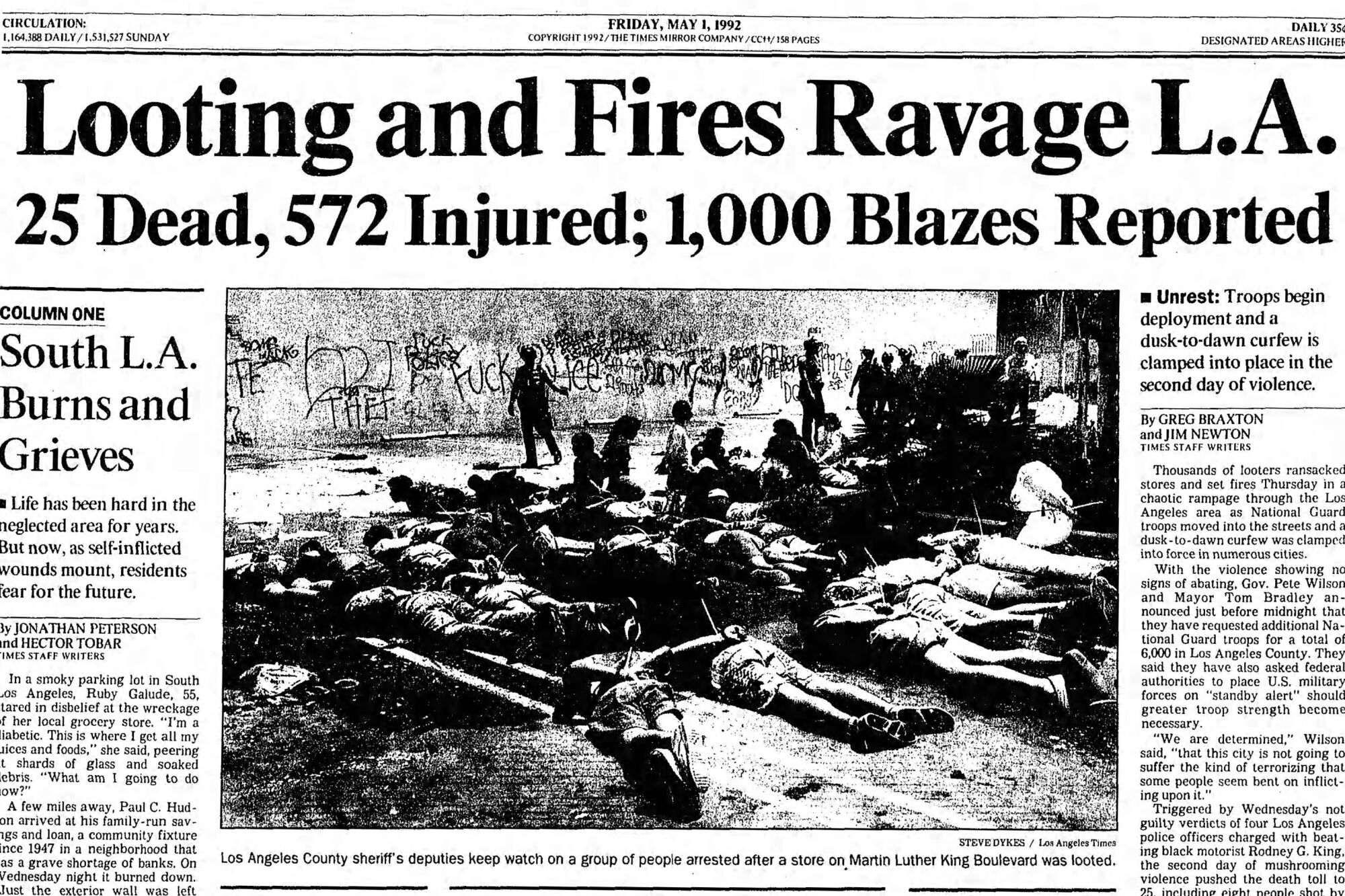 1992 LA Times front page headline reads "Looting and fires ravage LA. 25 dead, 572 injured; 1,000 blazes reported"
