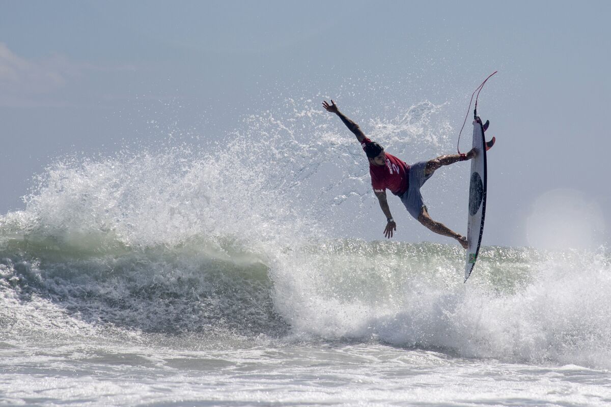 Brazil's Gabriel Medina rides a wave during the first round of the Olympic men's surfing competition.