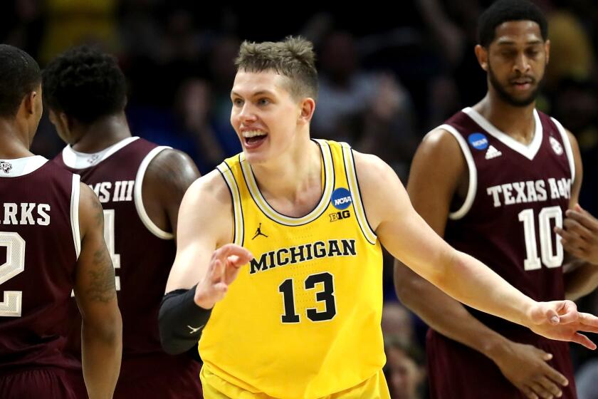 LOS ANGELES, CA - MARCH 22: Moritz Wagner #13 of the Michigan Wolverines celebrates after making a three-pointer in the first half against the Texas A&M Aggies in the 2018 NCAA Men's Basketball Tournament West Regional at Staples Center on March 22, 2018 in Los Angeles, California. (Photo by Ezra Shaw/Getty Images) ** OUTS - ELSENT, FPG, CM - OUTS * NM, PH, VA if sourced by CT, LA or MoD **