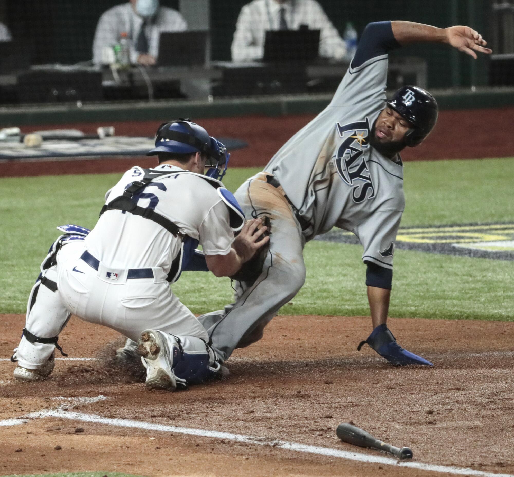 Tampa Bay Rays baserunner Manuel Margot is tagged out at home by Dodgers catcher Will Smith.