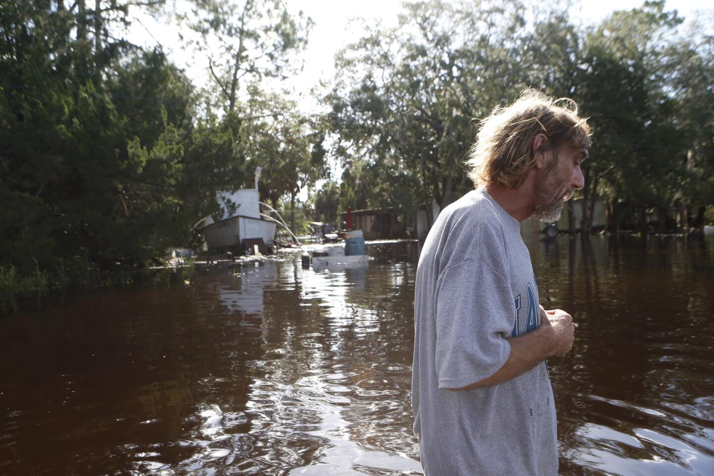 A resident surveys damage around his home from high winds and storm surge associated with Hurricane Hermine which made landfall overnight in Tampa, Florida.
