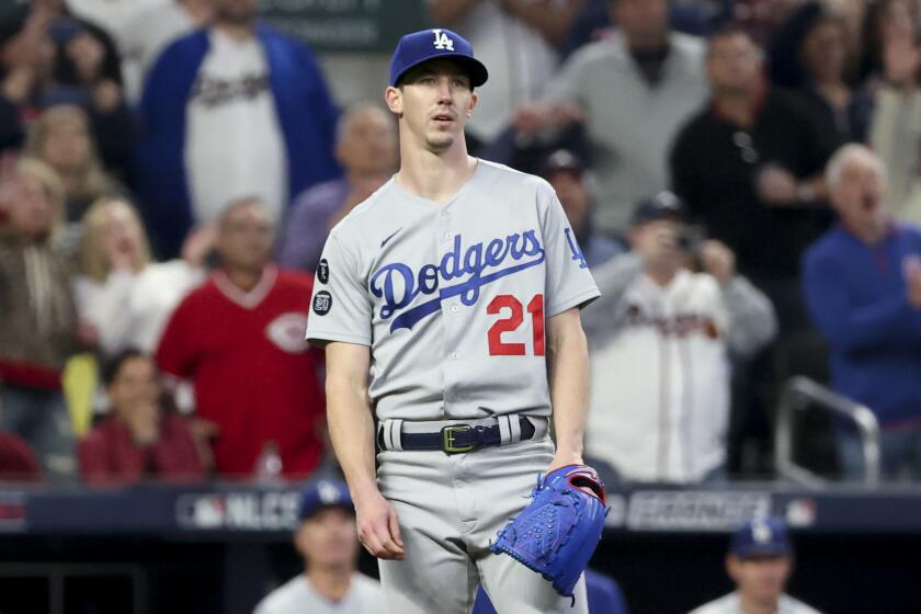 Atlanta, GA - October 23: Los Angeles Dodgers starting pitcher Walker Buehler reacts after allowing a three-run home run.