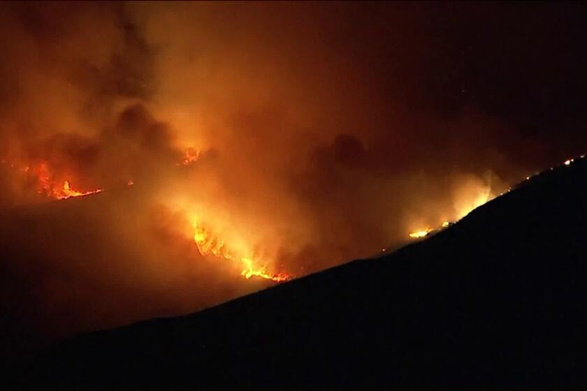 Crews are battling a brush fire atop South Mountain in Ventura County.