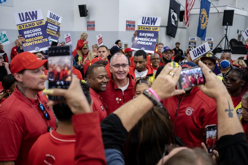 CHICAGO, ILLINOIS - OCTOBER 7: UAW President Shawn Fain greets members attending a rally in support of the labor union strike at the UAW Local 551 hall on the South Side on October 7, 2023 in Chicago, Illinois. UAW president Shawn Fain later spoke to members in solidarity with the ongoing strike (Photo by Jim Vondruska/Getty Images)