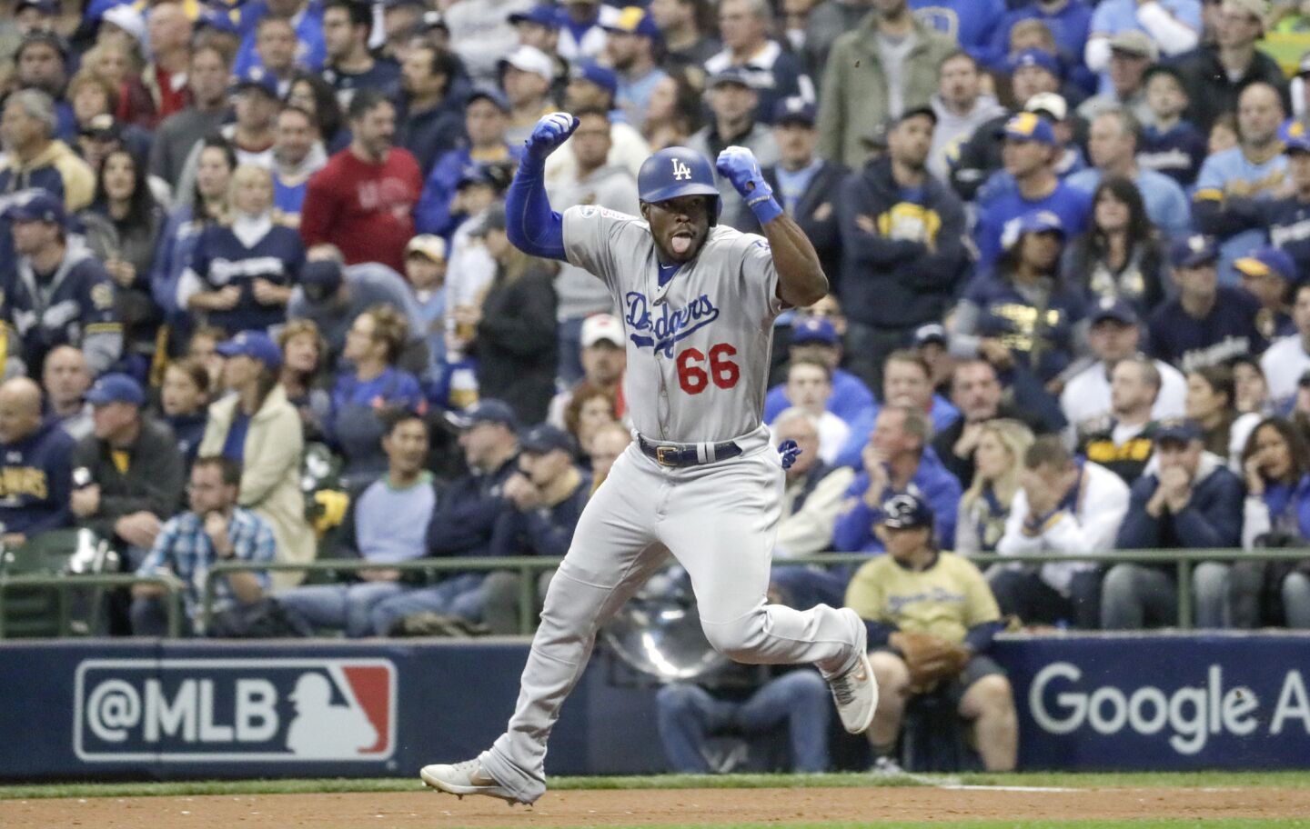 Dodgers Yasiel Puig celebrates after hitting a three run homer in the sixth inning.