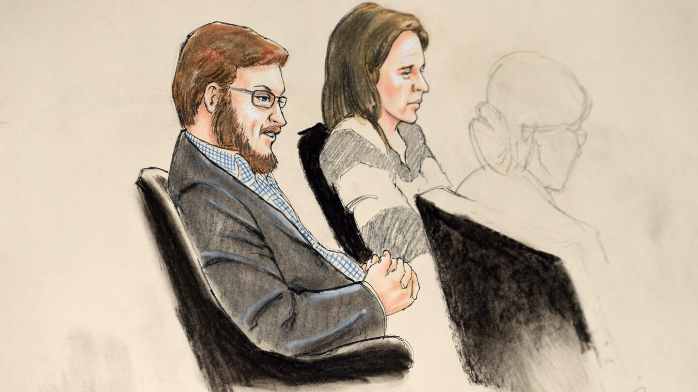 A courtroom sketch showing James Holmes with Arapahoe County Public Defender Tamara Brady at the Arapahoe District Courthouse in Centennial, Colo.