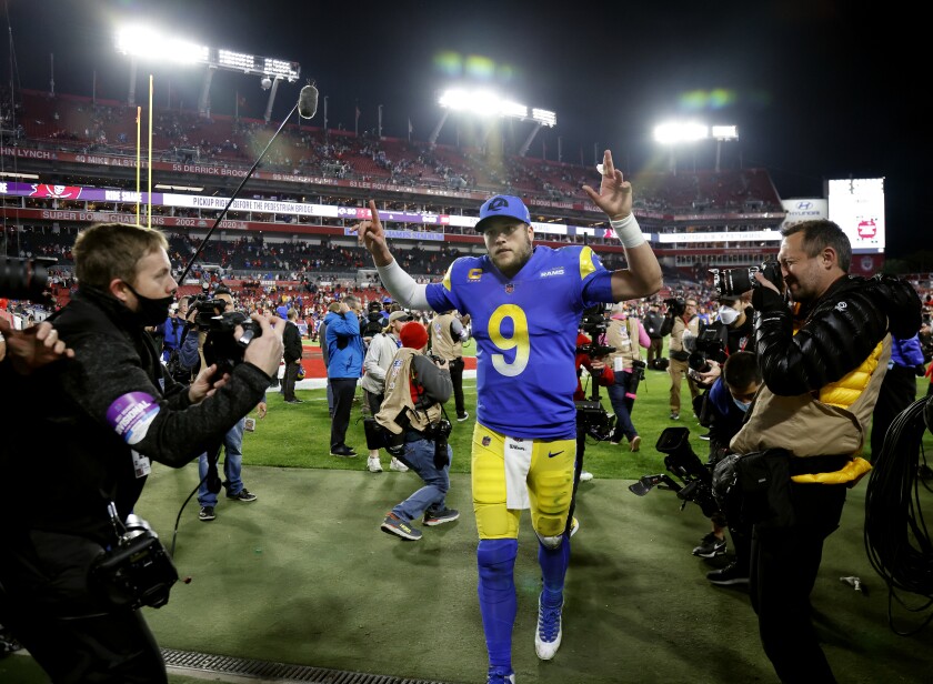  Rams quarterback Matthew Stafford (9) gives the victory sign as he leaves the field in Tampa.