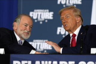 Republican presidential nominee Donald Trump talks with former Arkansas Gov. Mike Huckabee
