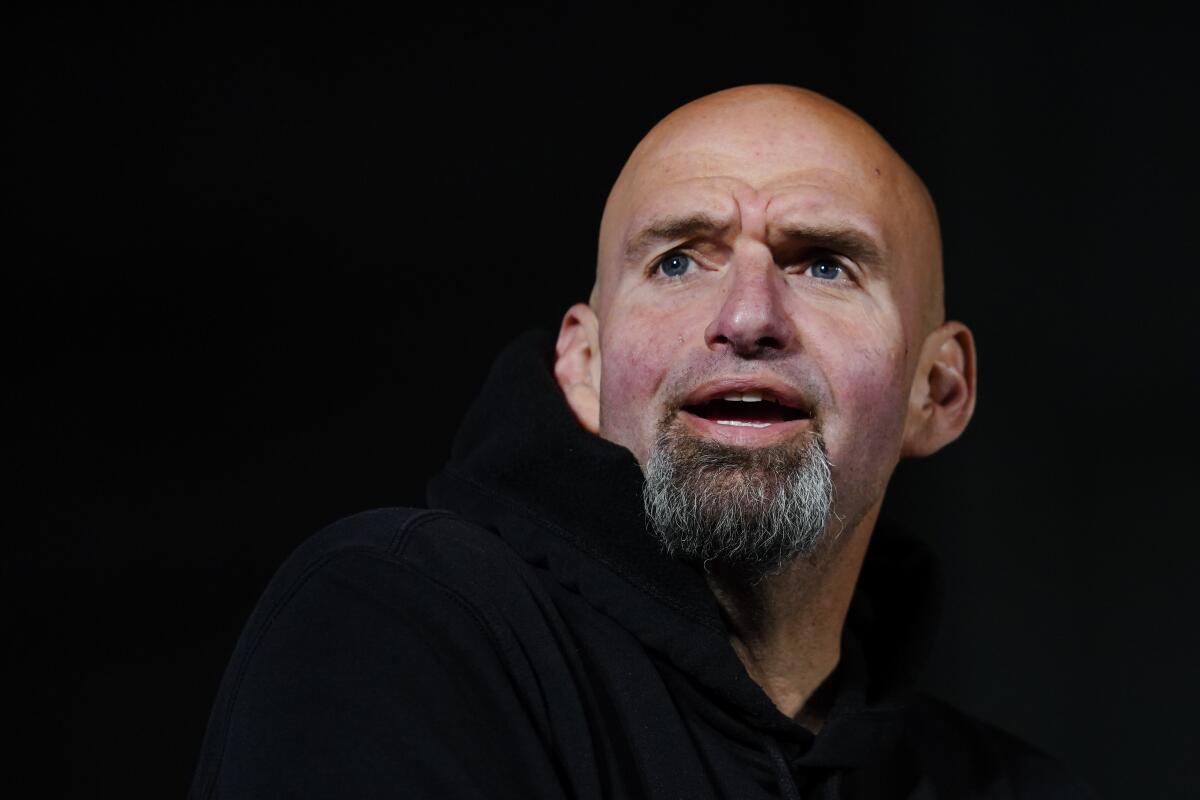 Lt. Gov. John Fetterman stands against a black background.