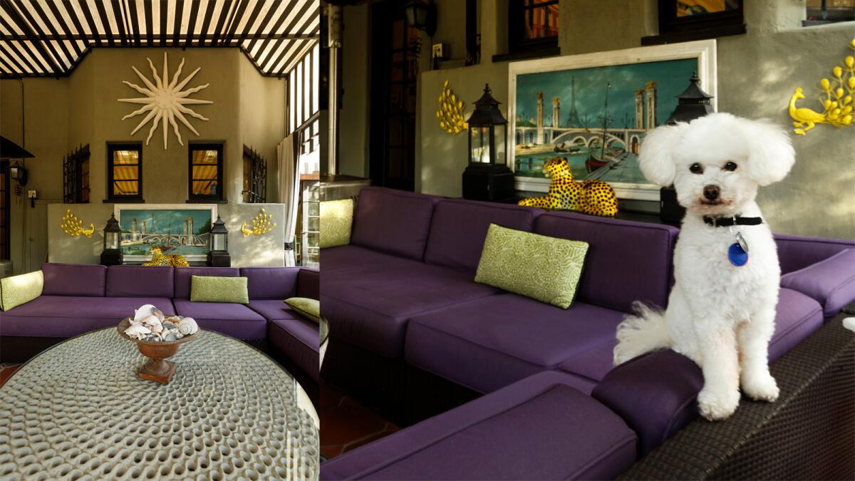 Jessie (right) strikes a pose in the outdoor living room. The outdoor sectional, in purple Sunbrella, is from Crate and Barrel. The painting is from the Santa Monica antique market.