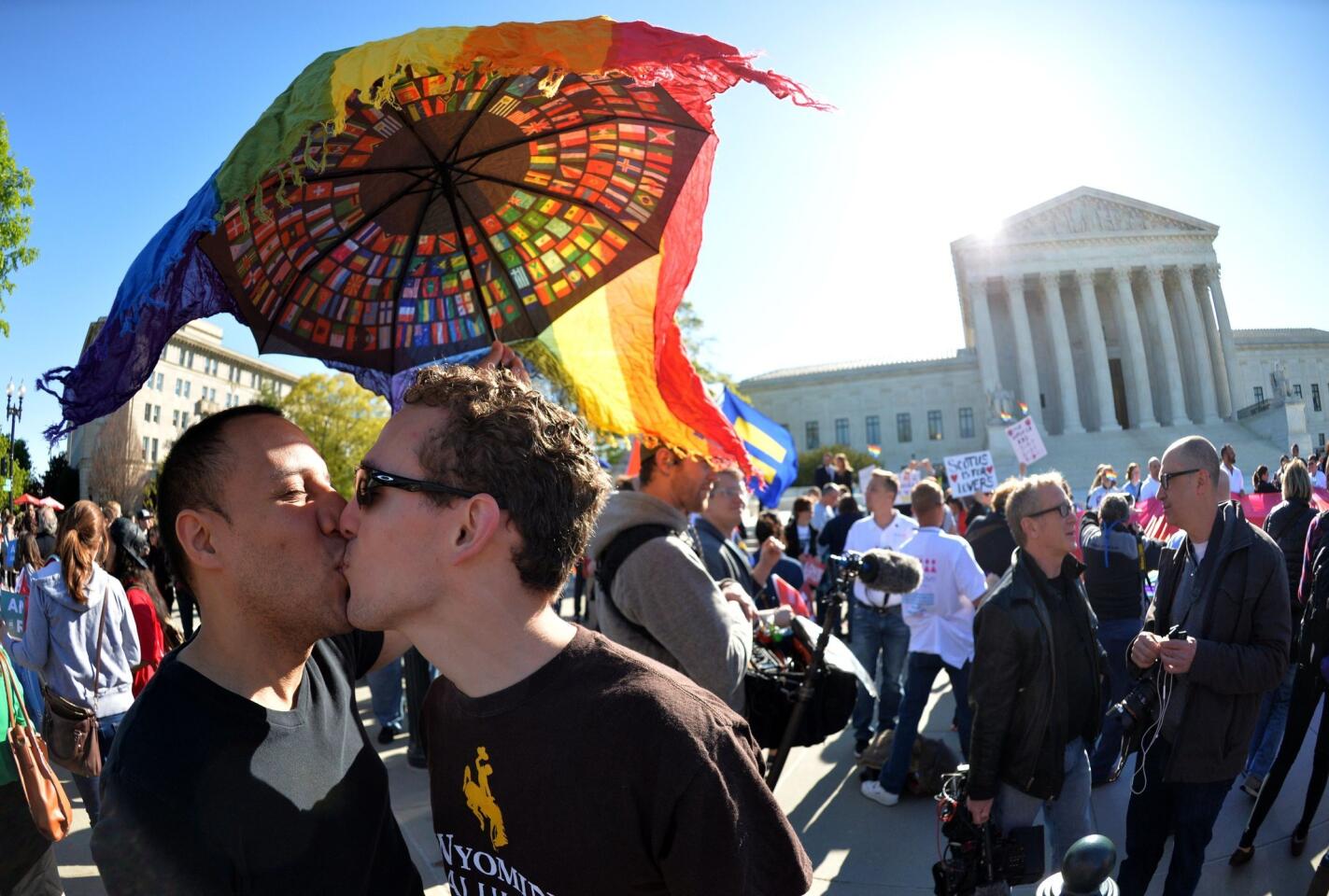 A couple kiss outside the U.S. Supreme Court, where justices are hearing arguments on whether gay couples have a constitutional right to wed -- a potentially historic decision that could see same-sex marriage recognized nationwide.