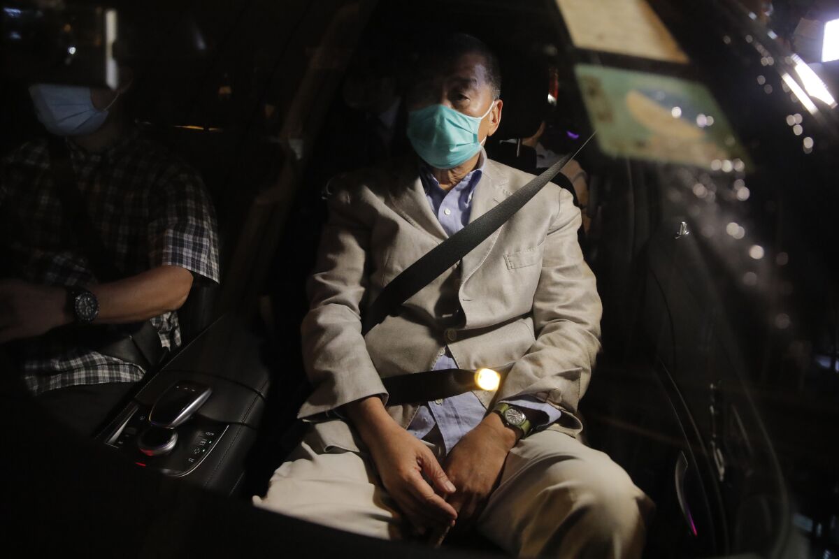 Hong Kong media tycoon and newspaper founder Jimmy Lai, sits in a car as he leaves a police station after being bailed out in Hong Kong, Wednesday, Aug. 12, 2020. The rounding up of the paper’s founder Jimmy Lai, the previous day and a raid on its headquarters have reinforced fears that a new national security law will be used to suppress dissent in Hong Kong after months of anti-government protests.(AP Photo/Kin Cheung)