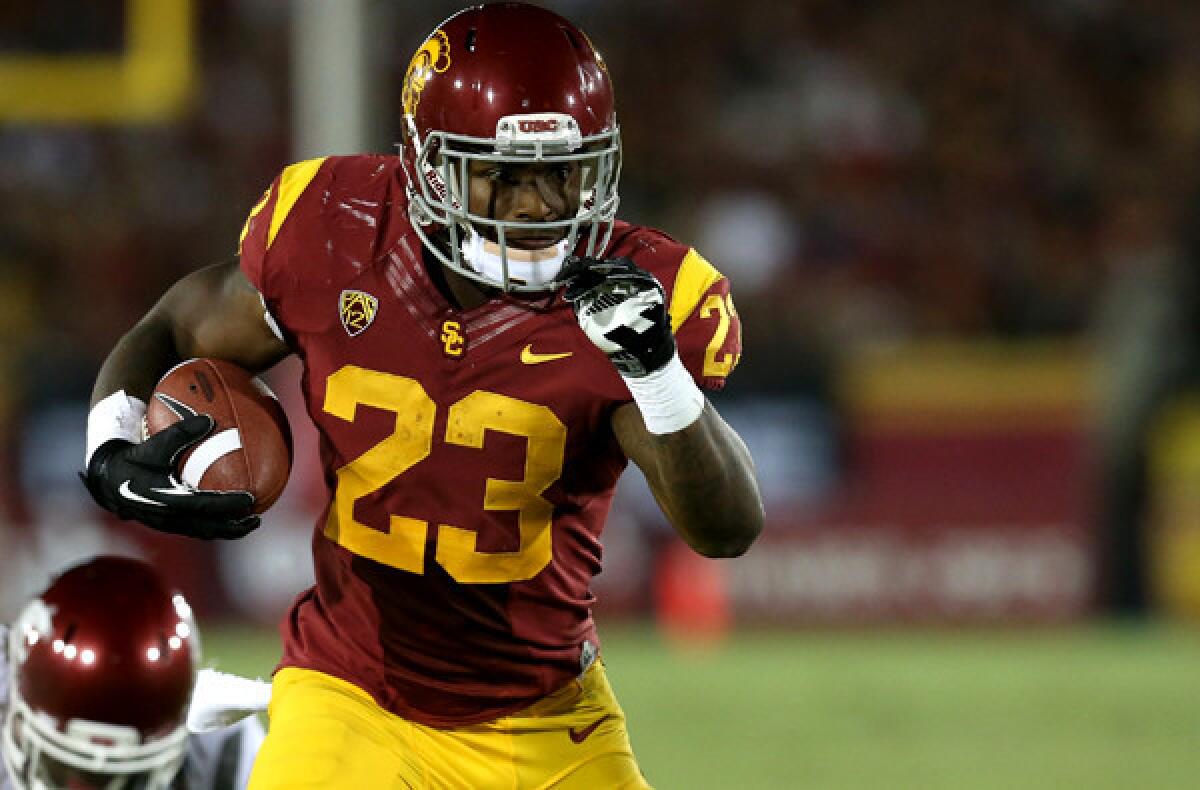 USC running back Tre Madden breaks into the clear against Washington State on Saturday night at the Coliseum.
