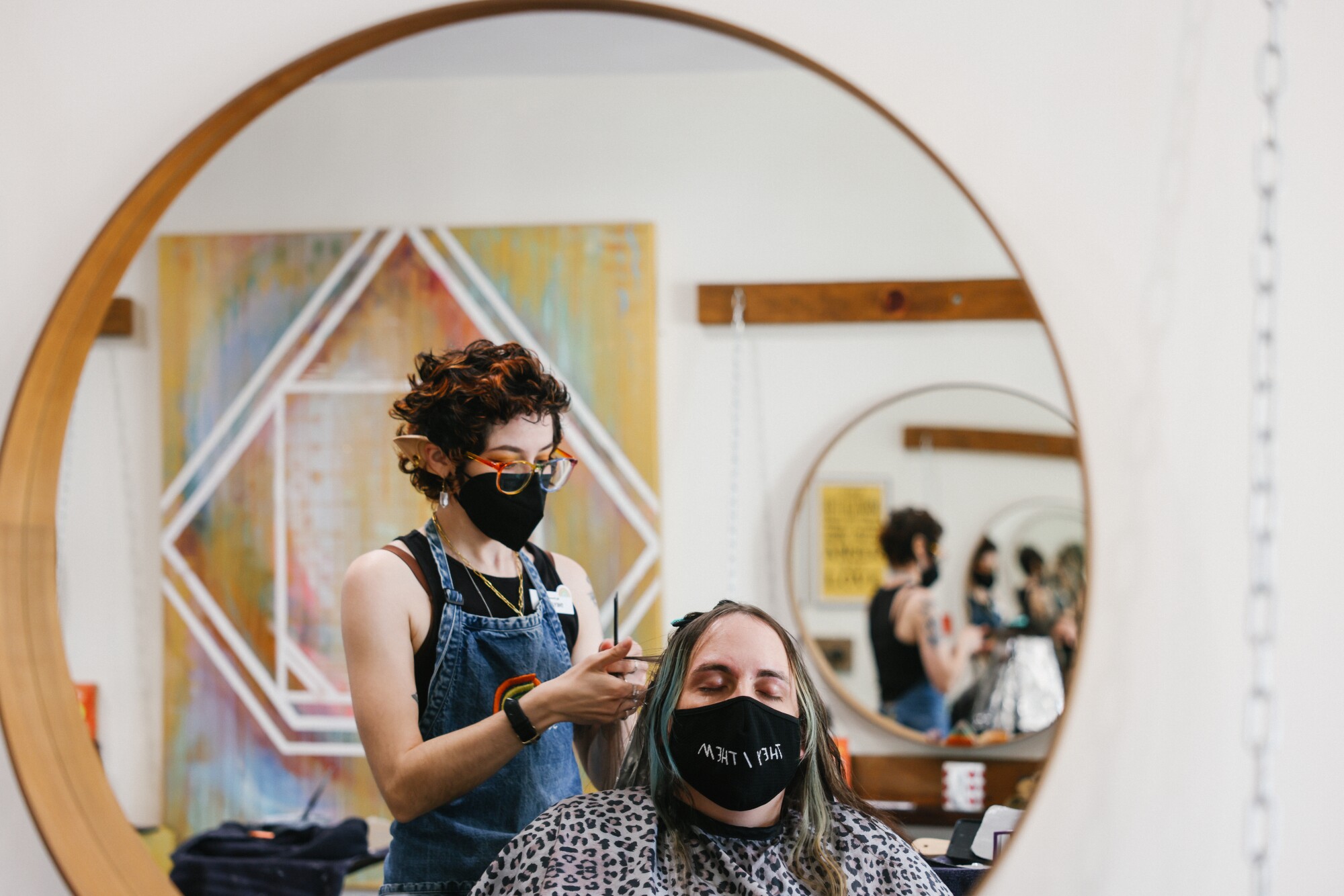 A person gets their hair done at a salon.