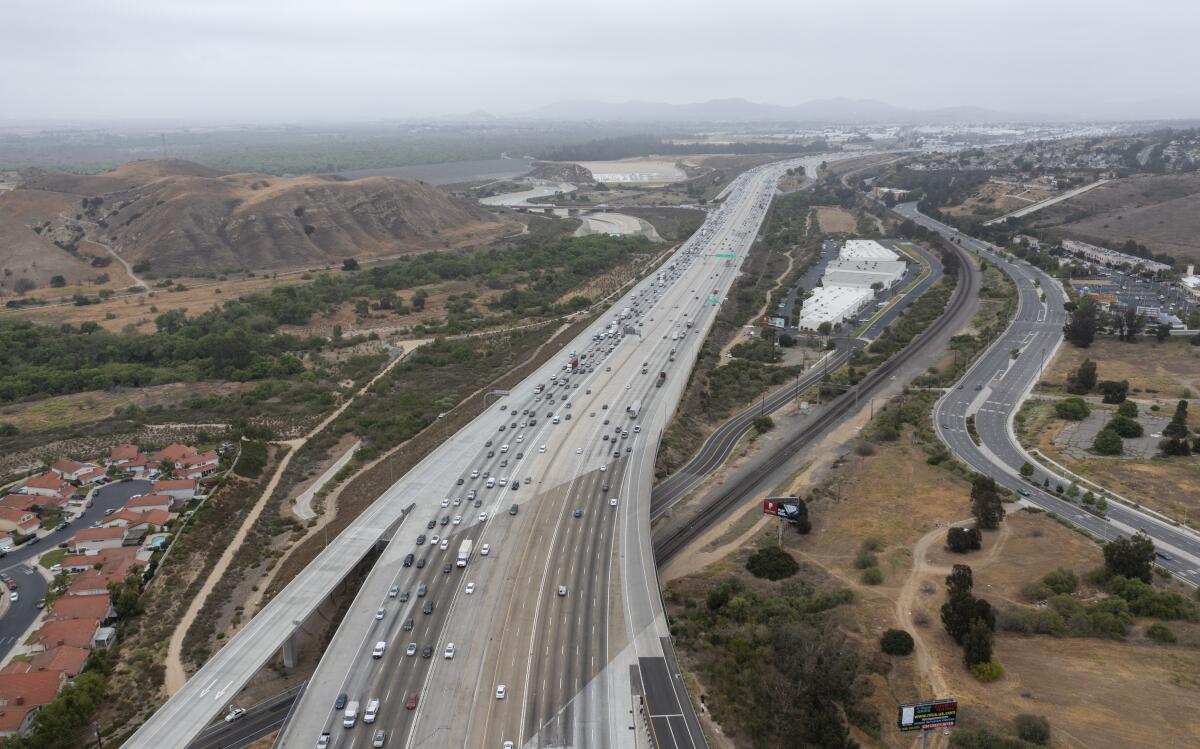 An aerial view of traffic on the 91 Freeway looking east from the Green River Road overpass