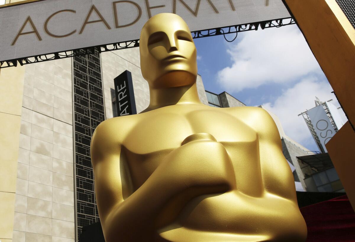 An Oscar statue appears outside the Dolby Theatre in Hollywood.