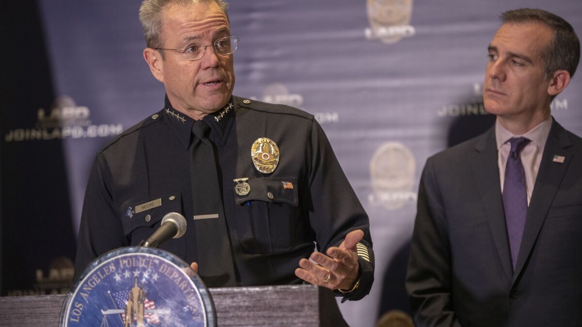 Mayor Eric Garcetti, right, during a press conference with LAPD Chief Michel Moore on Monday.