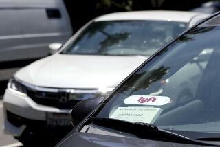 FILE - In this July 9, 2019, file photo a Lyft ride-share car waits at a stoplight in Sacramento, Calif. Ride-hailing service Lyft's annual loss more than doubled last year to over $2.6 billion, but the company claimed progress as revenue jumped 68% and ridership grew. (AP Photo/Rich Pedroncelli, File)