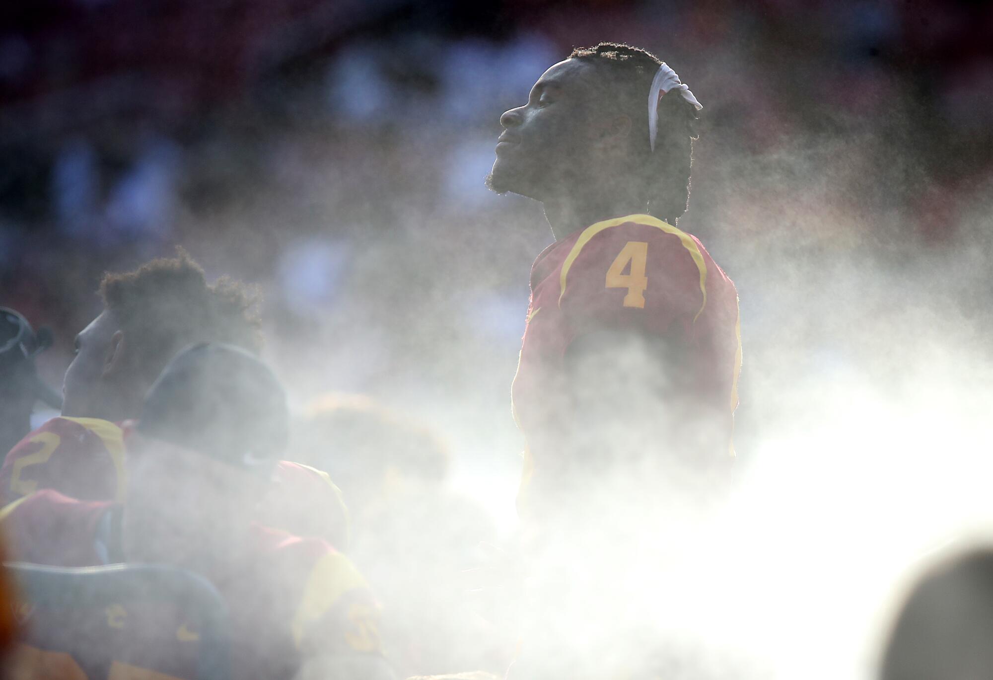 USC wide receiver Mario Williams cools off in the mist of a sideline fan during the Trojan's home opener against Rice.