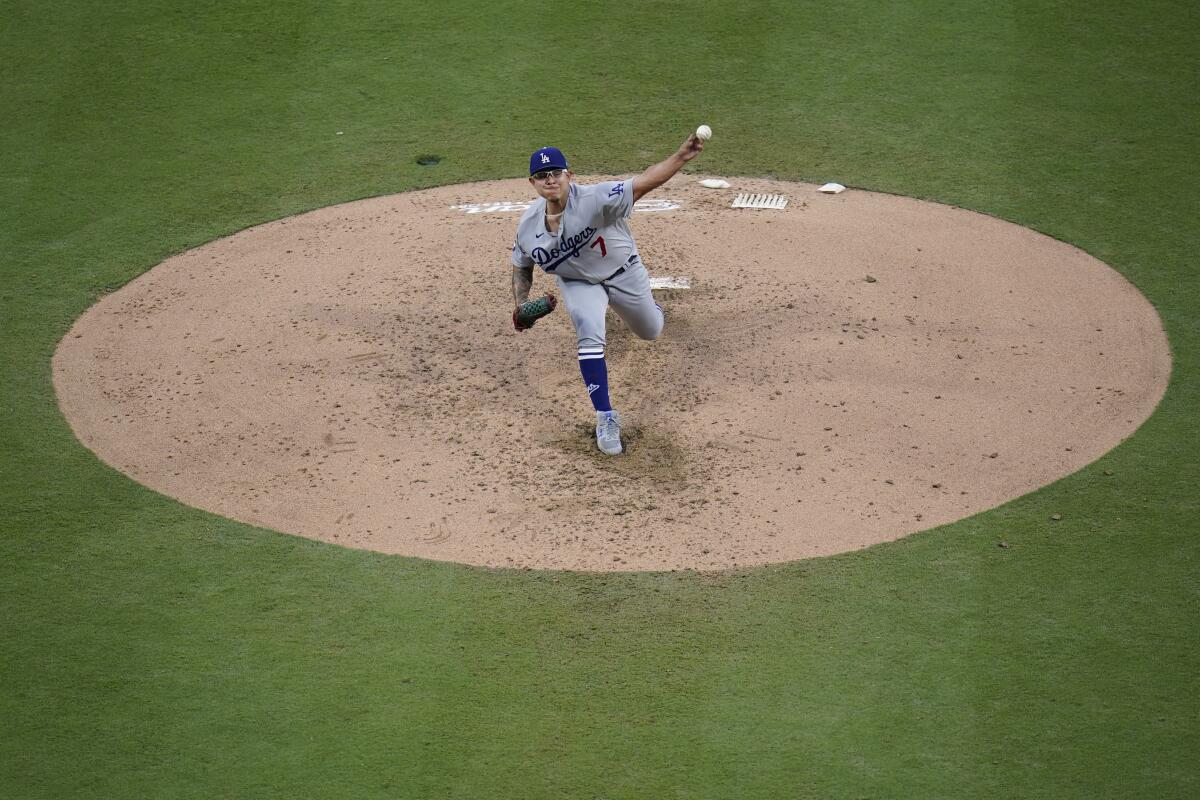 Dodgers starting pitcher Julio Urías throws against the Padres in the fourth inning Saturday.