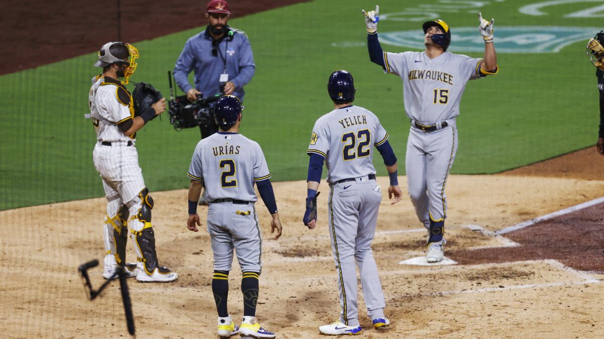 Burnes outlasts Snell as Taylor, Brewers beat Padres 4-1